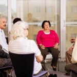 Group of mature and senior adults participating the seminar while they sitting in the circle.